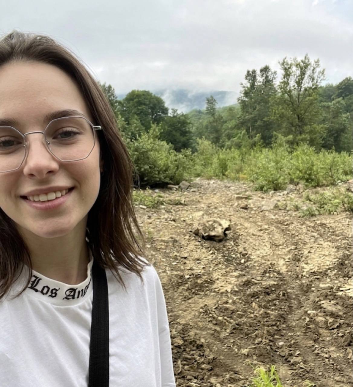 Mila outdoors on a mountain trail